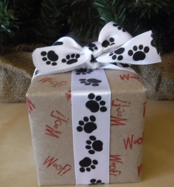 DIY Dog Gift Wrap with red Woof stamp and black and white paw print