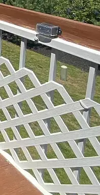 Lattice fencing secure to deck rail