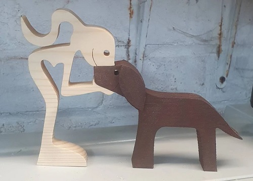 Handmade wooden piece featuring a woman and her dog. - Etsy.com