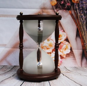 Hourglass with ashes as sand. 