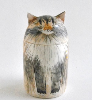 Ceramic urn in the shape of a cat with a cat painted on it. 