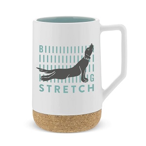 Coffee mug in cream with dog stretching on the front and the words " Biiiiiiiiiiiig Stretch" cork bottom