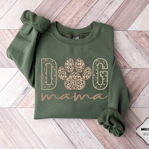 Dog Mama Sweatshirt in green with gold lettering that states Dog Mama