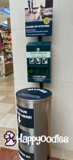 Pet clean up station with waste bags wipes and garbage bin. 