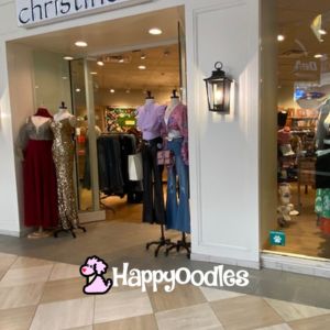 Dog friendly clothing store with sign. 