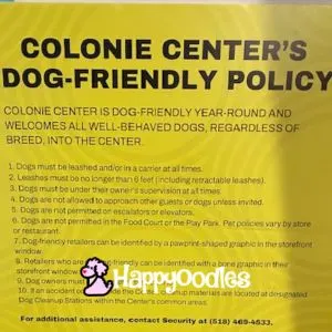 Yellow sign with Dog Friendly Policy.
