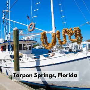 Tarpon Springs Florida, with sailboat and sea sponges hanging from the sail. 