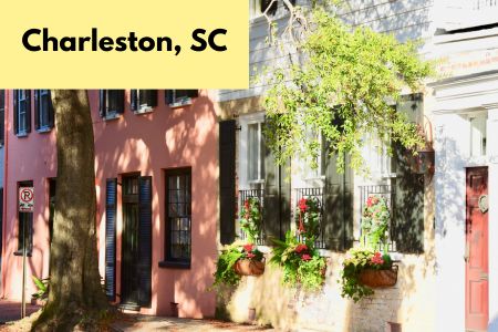 Title on page Charleston, SC - pic of colorful houses with window planters and a tree.