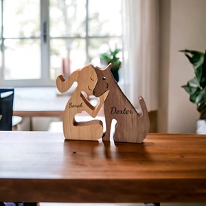 Handmade wooden figures of a women sitting with a dog that fit together like a puzzle. Each figure is a different wood, with names craved into the wood.