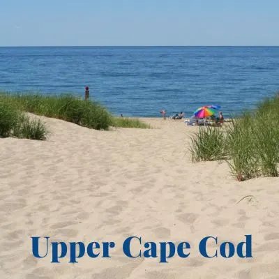 Title "Upper Cape Cod" Picture of sandy beach with ocean in the background.