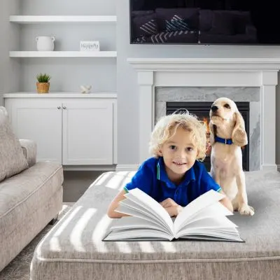 Kid with dog and book